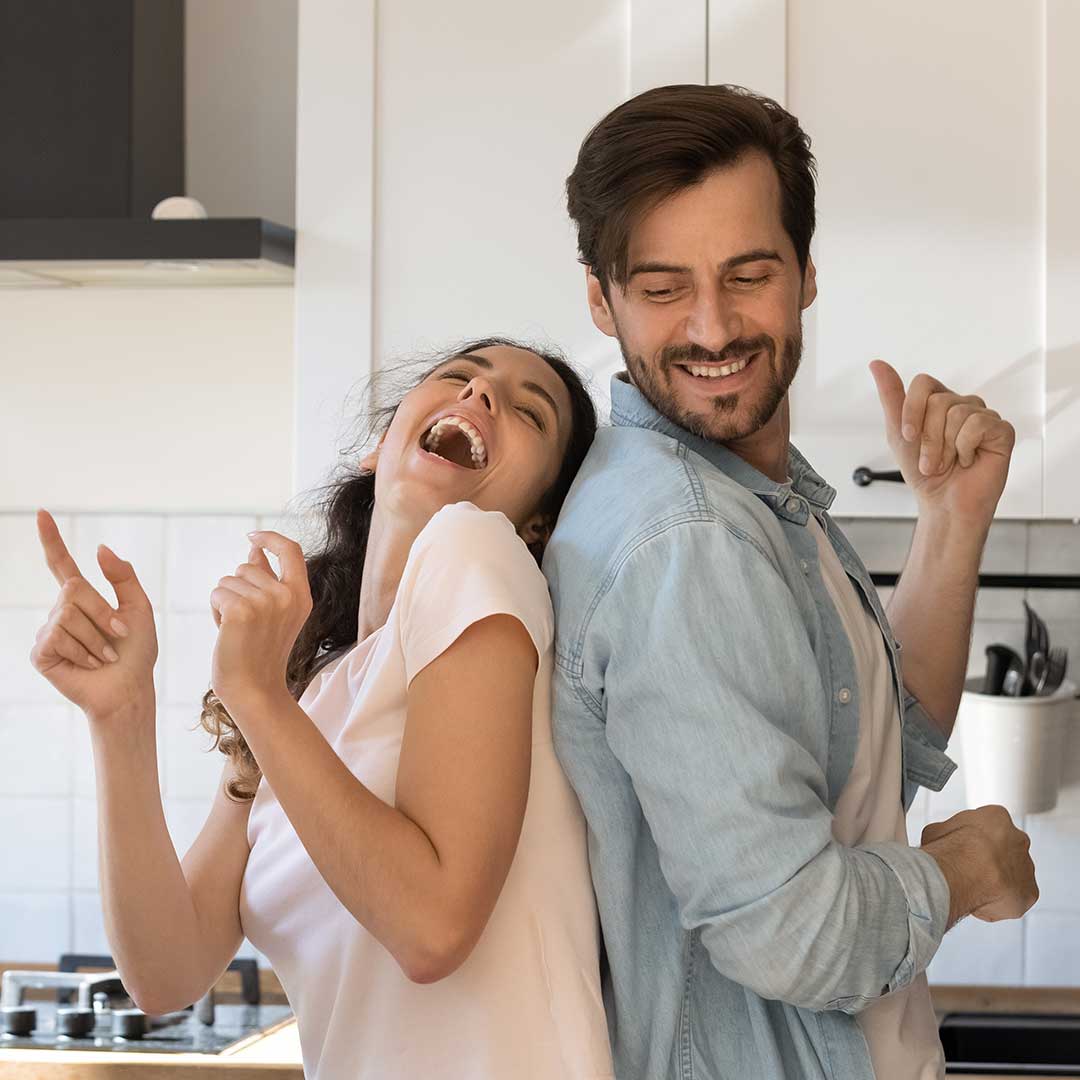 couple dancing in the kitchen