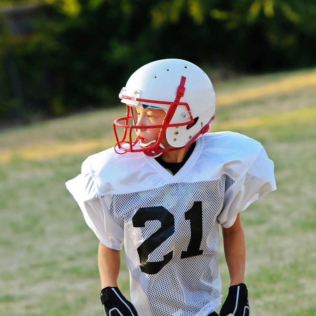 Kid playing football